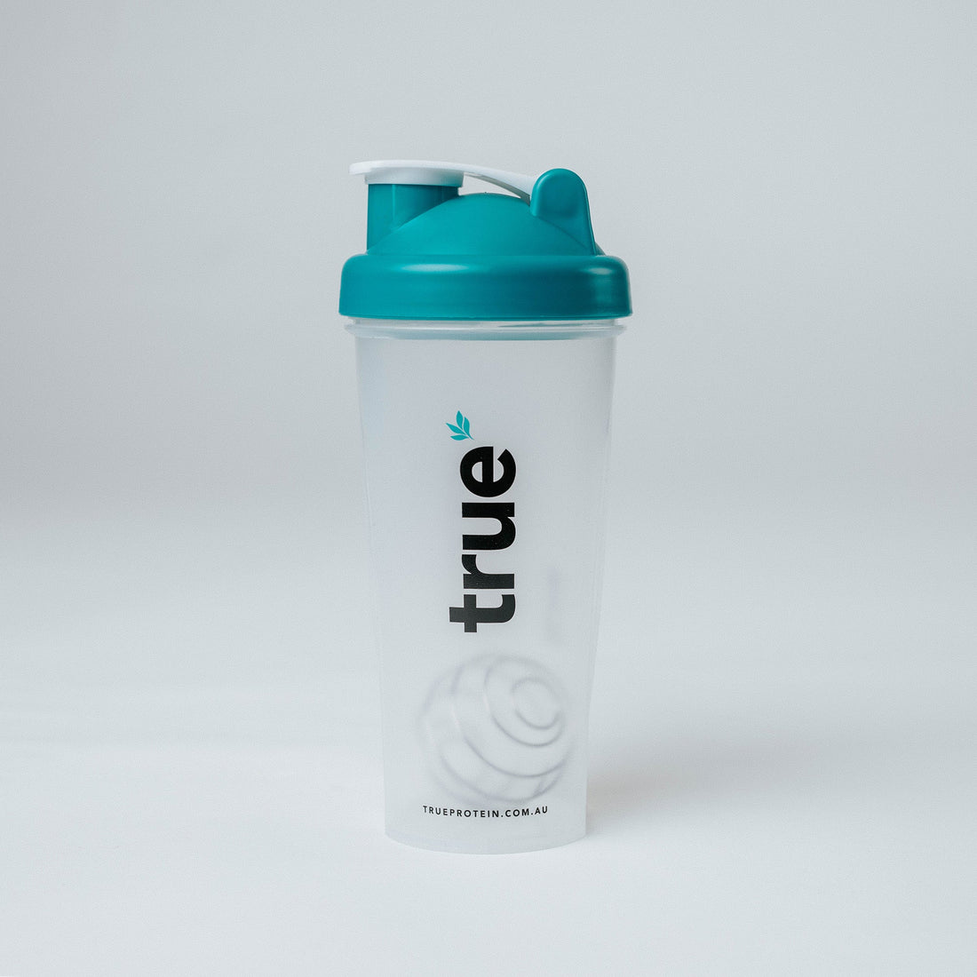 True Protein large clear plastic protein shaker bottle with teal screw-on flip lid, embossed mixing ball visible, vertical "true" logo — Australia (trueprotein.com.au)