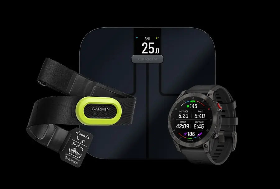 Garmin fitness bundle: black Garmin smart scale displaying BMI 25.0, neon-accent heart rate chest strap, and black Garmin multisport GPS smartwatch on black background - health and running accessories for GPS tracking, heart rate monitoring and body composition.